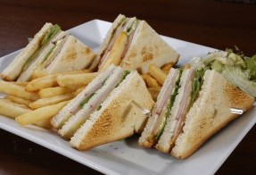 Club sandwich with ham and Gouda cheese